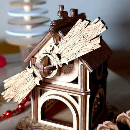 Macro close-up of the detailed rotating sails with engraved wood grain on a laser cut plywood miniature forest windmill.