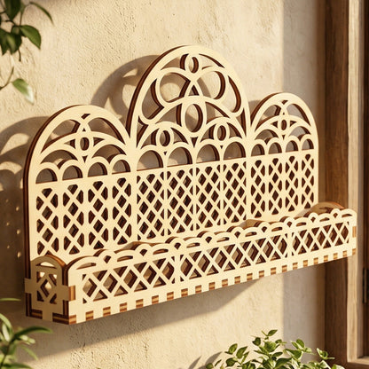 Close-up of a triple-arch wooden wall shelf made from laser-cut plywood. The design features high-contrast dark edges and a beautiful geometric lattice. A versatile home decor piece designed for holding small plants, herbs, or decorative collectibles.